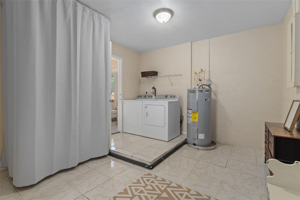 4325 South Canton Terrace Inverness, FL 34452 - Photo 18 of 35 a utility room with cabinets washer and dryer