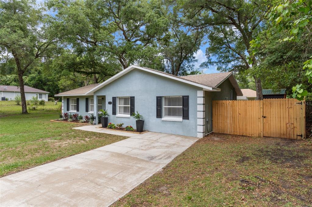 4325 South Canton Terrace Inverness, FL 34452 - Photo 26 of 35 a front view of house with yard and trees in the background