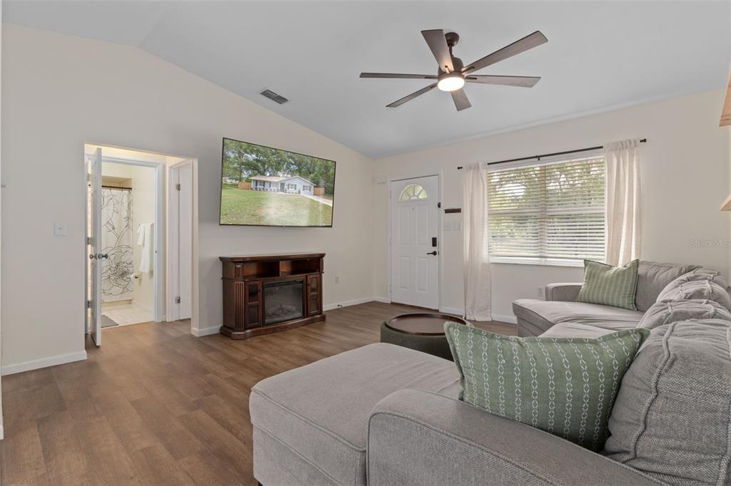 4325 South Canton Terrace Inverness, FL 34452 - Photo 31 of 35 a living room with furniture and a fireplace