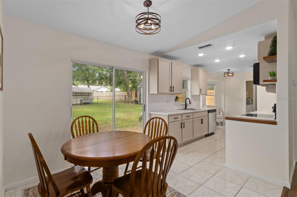 4325 South Canton Terrace Inverness, FL 34452 - Photo 32 of 35 a view of a dining room with furniture a livingroom and chandelier