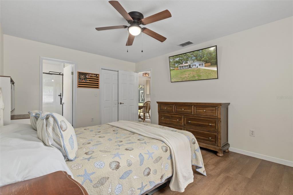 4325 South Canton Terrace Inverness, FL 34452 - Photo 35 of 35 a bedroom with a bed and a chandelier