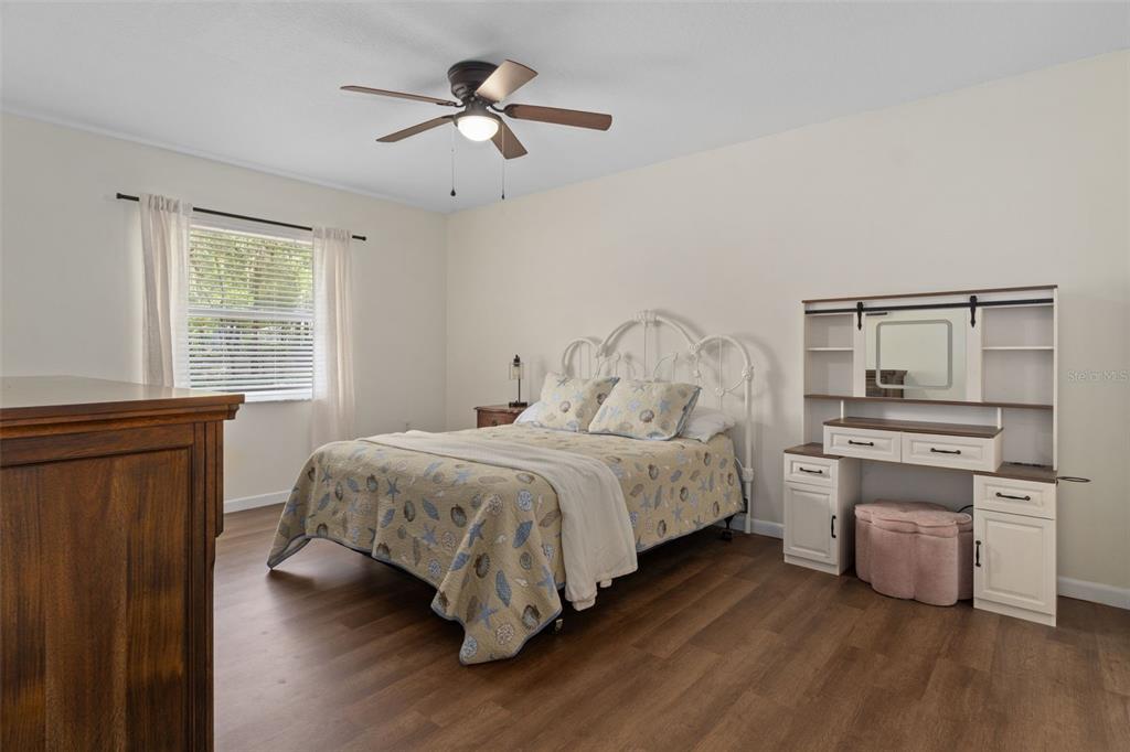 4325 South Canton Terrace Inverness, FL 34452 - Photo 7 of 35 a bedroom with a bed and a chandelier