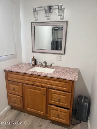 a bathroom with a sink and a mirror