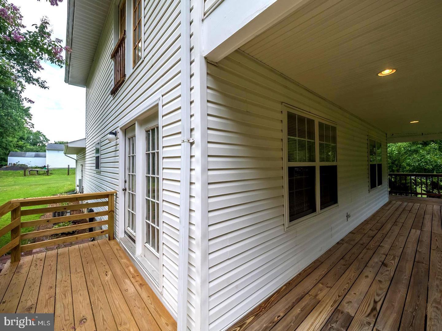 7701 Croom Road Upper Marlboro, MD 20772 - Photo 13 of 53 Charming exterior with inviting deck space.