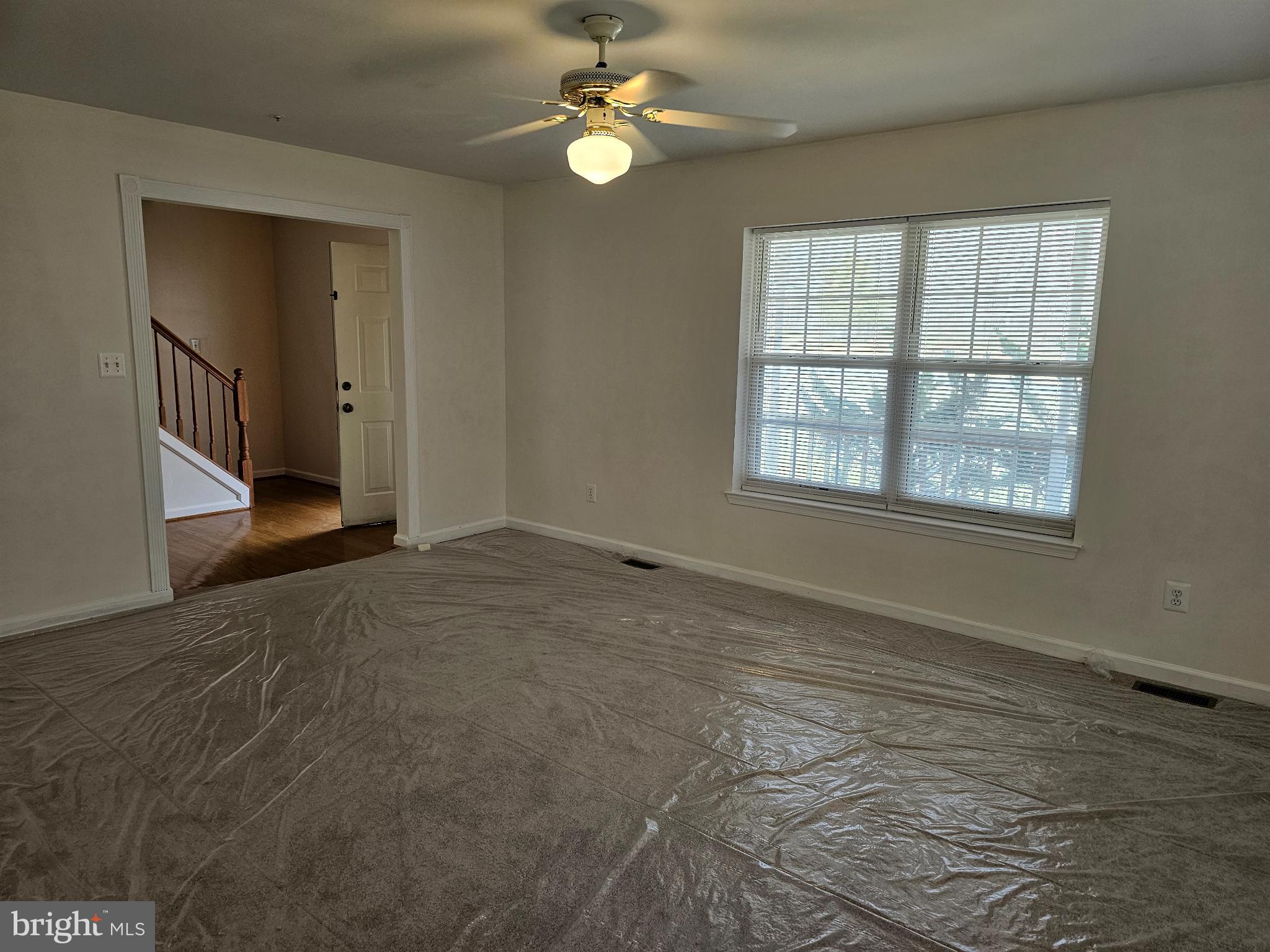 7701 Croom Road Upper Marlboro, MD 20772 - Photo 39 of 53 Living room showing stairs to upper level