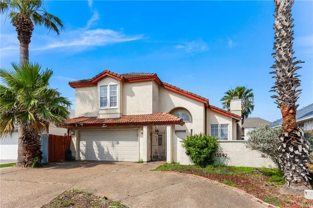 a front view of a house with a garage