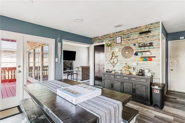 a bedroom with a bed and flat screen tv