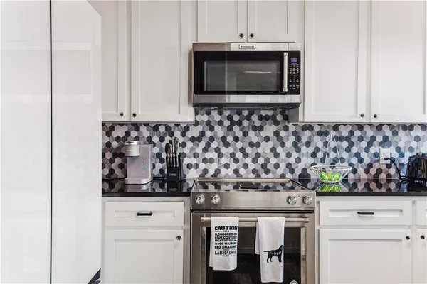 a kitchen with a stove and a microwave