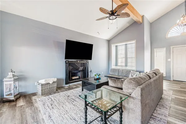 a living room with furniture and a flat screen tv