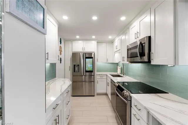 a kitchen with a stove and a microwave