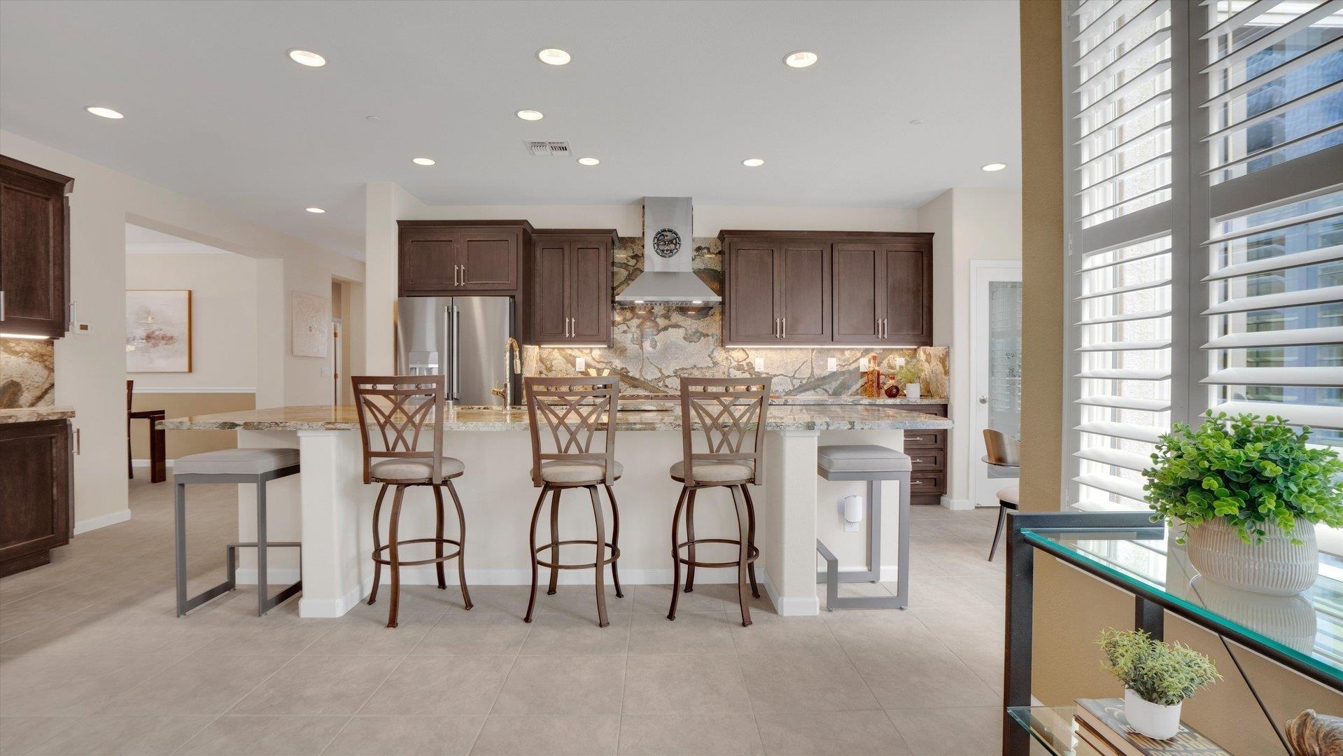 499 Twin Lakes Lane Rio Vista, CA 94571 - Photo 11 of 32 a kitchen with stainless steel appliances kitchen island granite countertop a refrigerator and cabinets