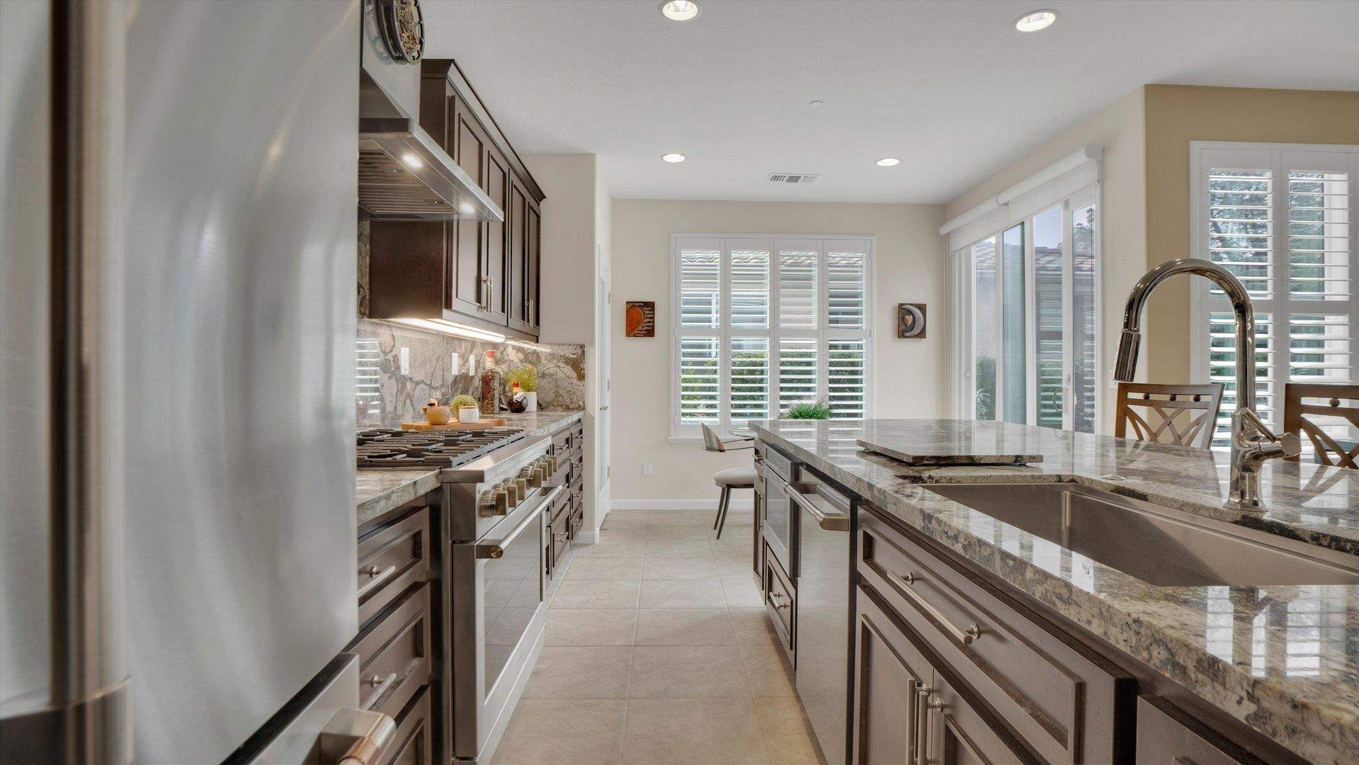 499 Twin Lakes Lane Rio Vista, CA 94571 - Photo 12 of 32 a kitchen with granite countertop a sink and a stove