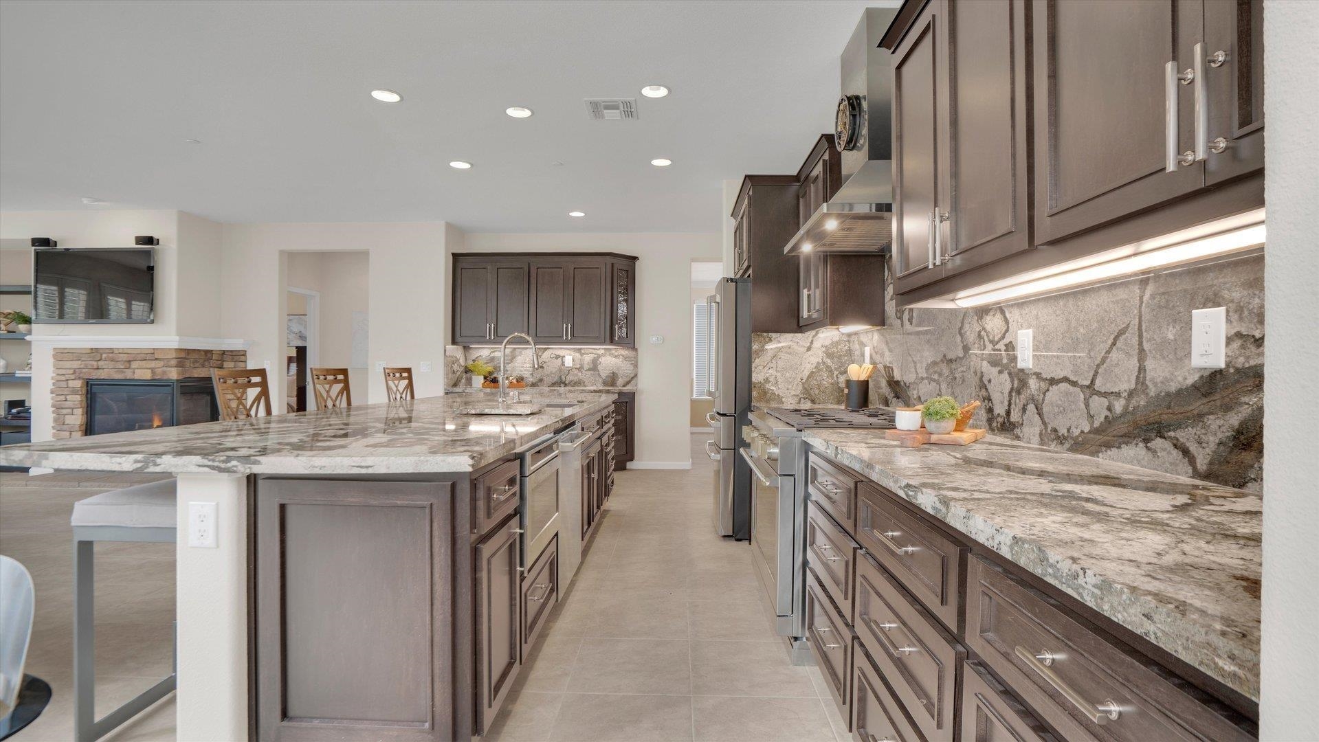 499 Twin Lakes Lane Rio Vista, CA 94571 - Photo 13 of 32 a kitchen with stainless steel appliances granite countertop a sink and stove