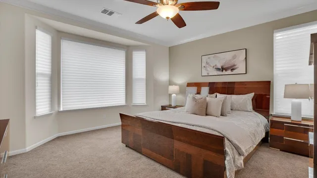 a bathroom with a sink a faucet a mirror and a shower