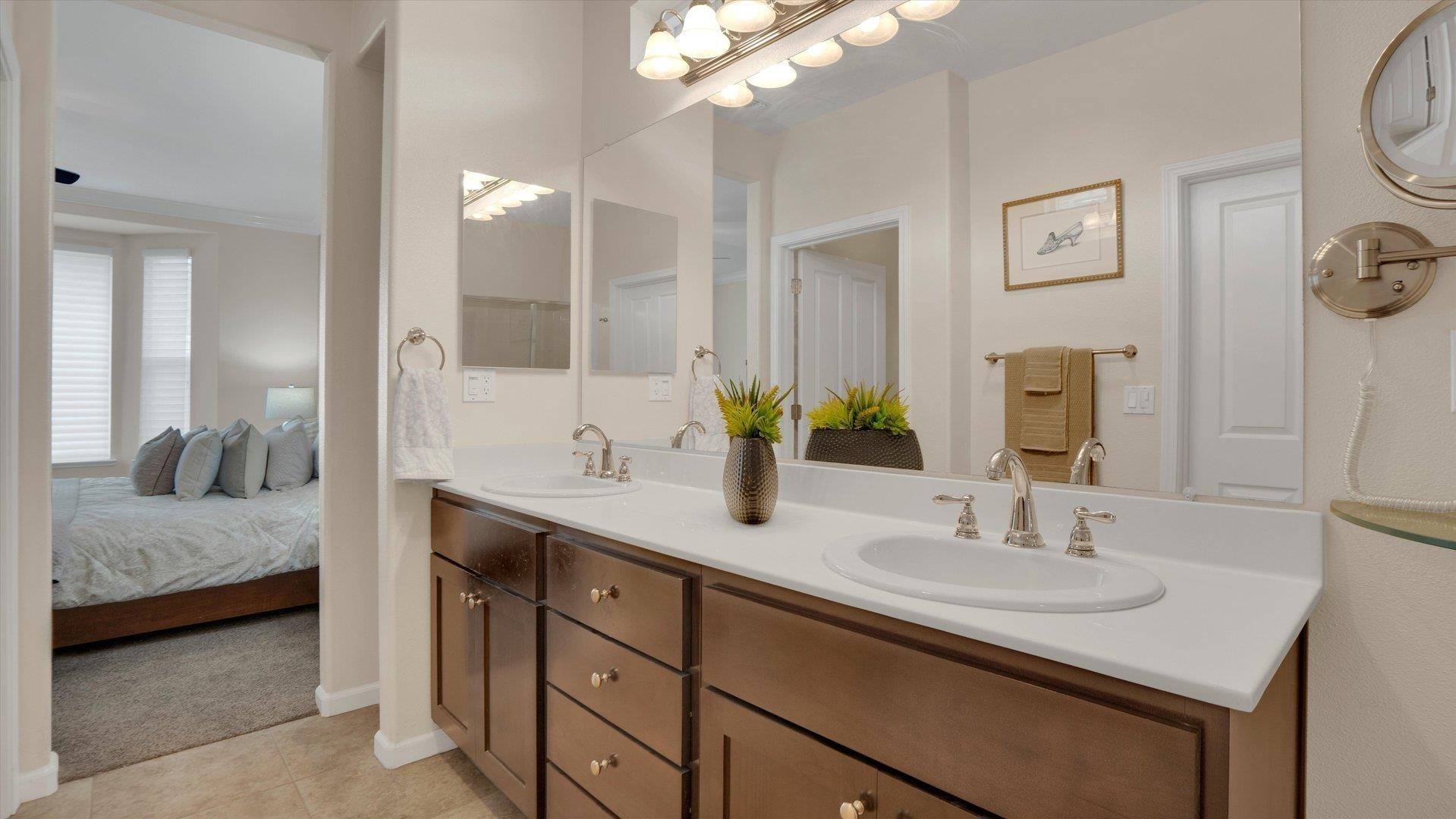 499 Twin Lakes Lane Rio Vista, CA 94571 - Photo 19 of 32 a en suite bathroom with a sink and a mirror