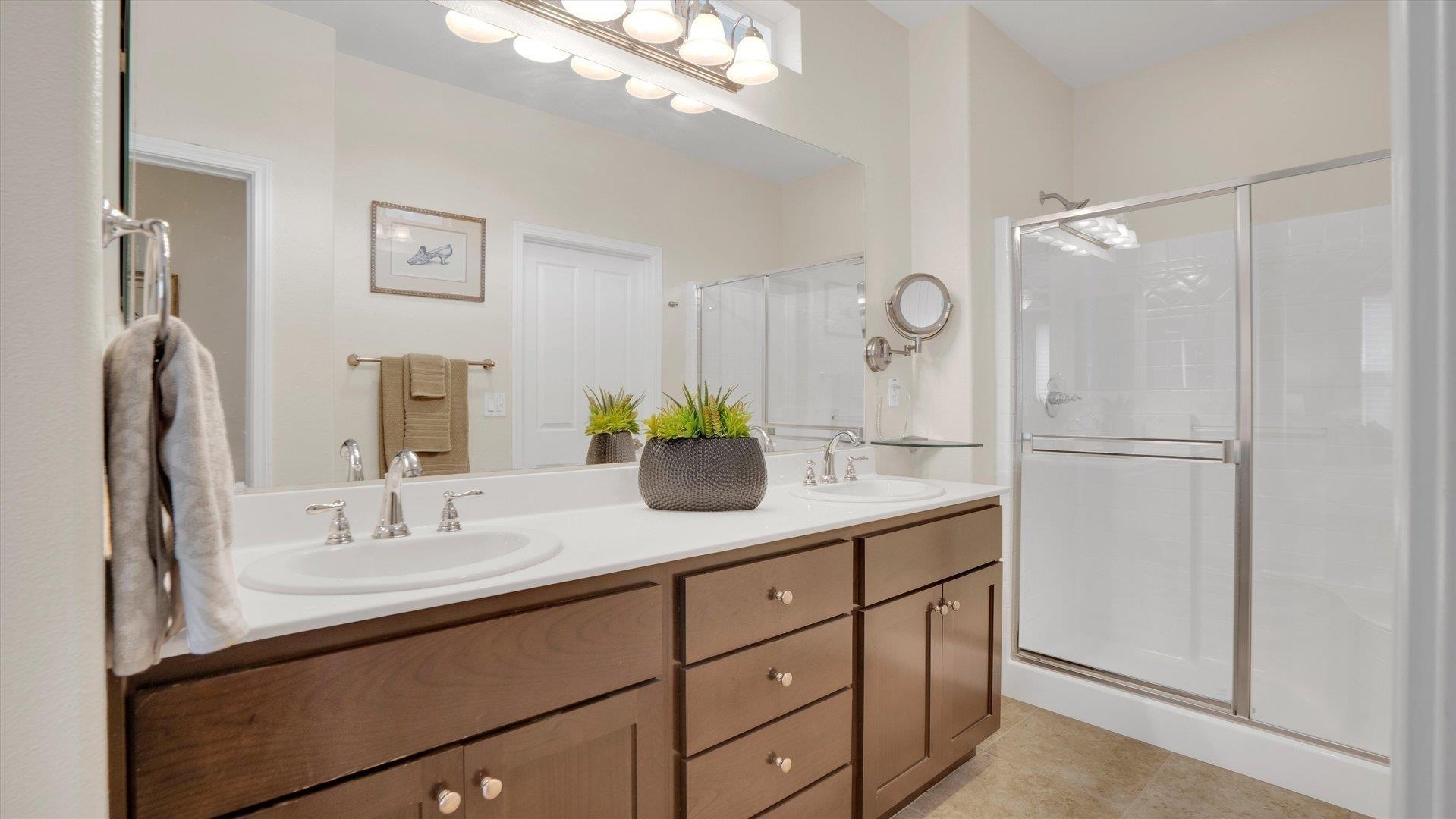 499 Twin Lakes Lane Rio Vista, CA 94571 - Photo 20 of 32 a bathroom with a sink a faucet a mirror and a shower