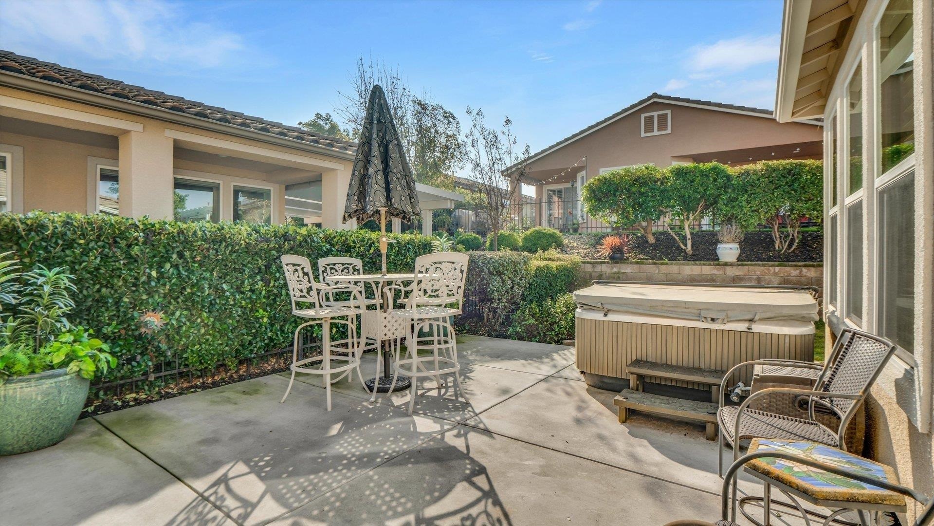 499 Twin Lakes Lane Rio Vista, CA 94571 - Photo 27 of 32 a view of a patio with table and chairs and potted plants