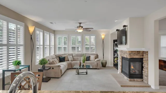 a kitchen with stainless steel appliances kitchen island granite countertop a refrigerator and cabinets