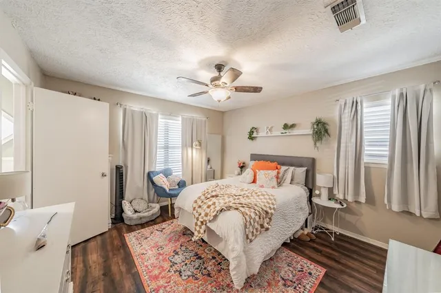 a bed room with a bed and a window