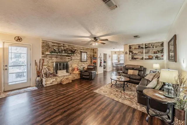 a living room with furniture or couch and a wooden floor