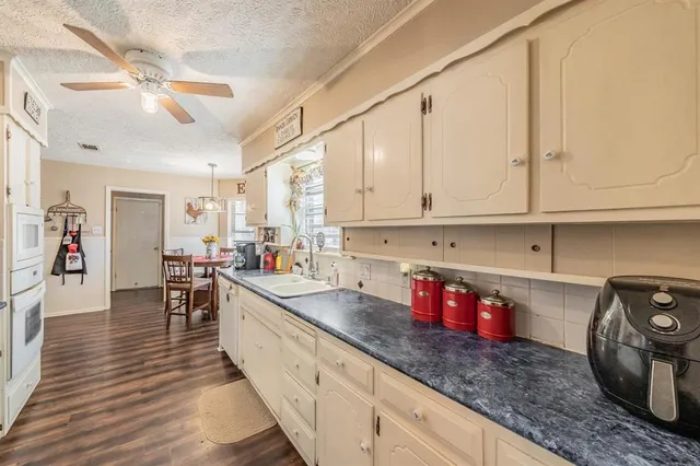 a kitchen with granite countertop lots of counter top space