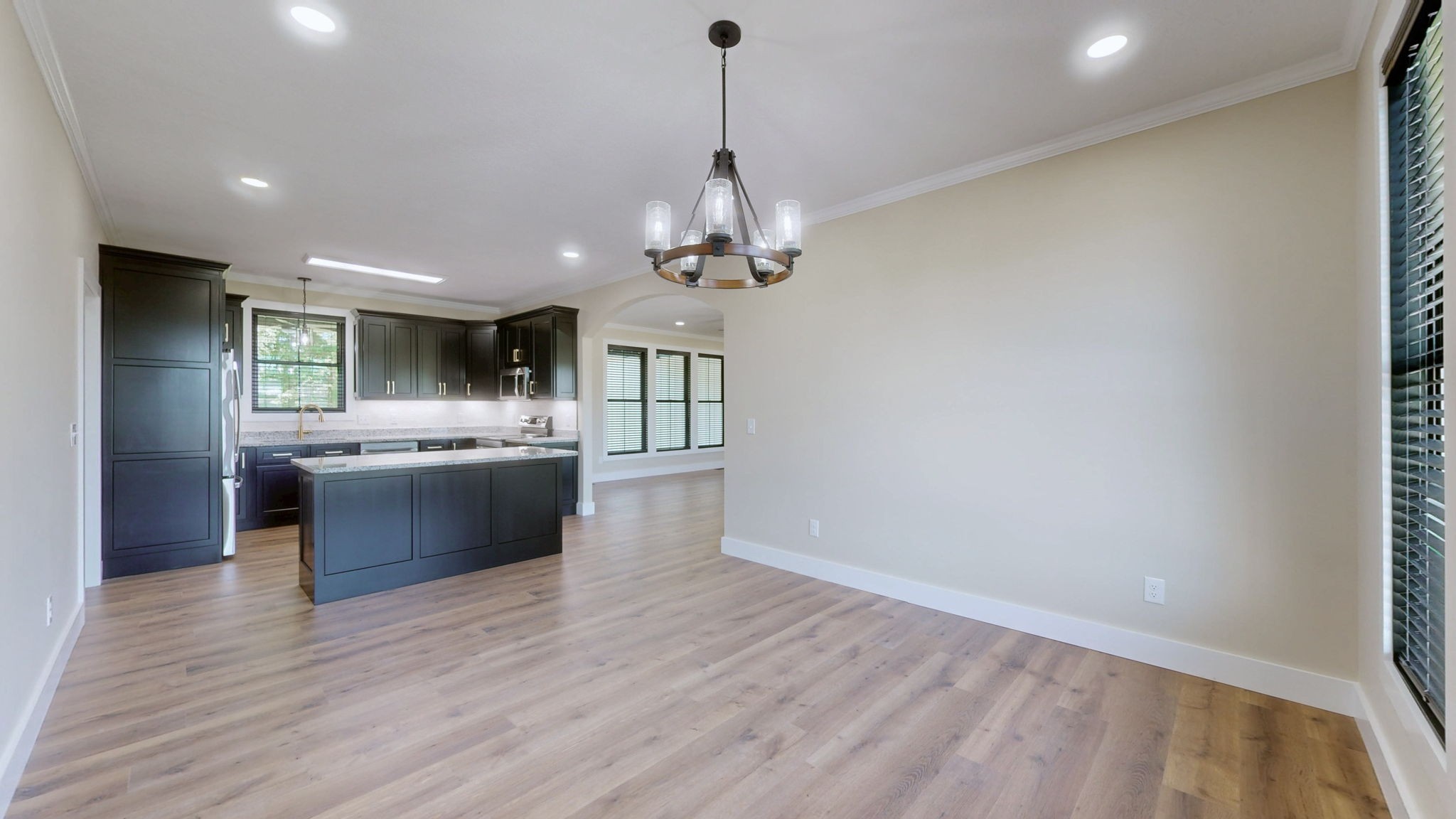 865 Alman Cemetery Road Paris, TN 38242 - Photo 6 of 41 a large kitchen with a sink and dishwasher a oven with wooden floor