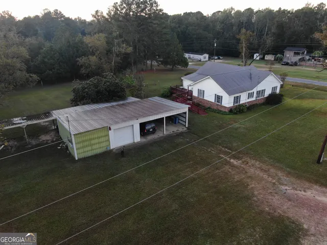 an aerial view of a house with a garden