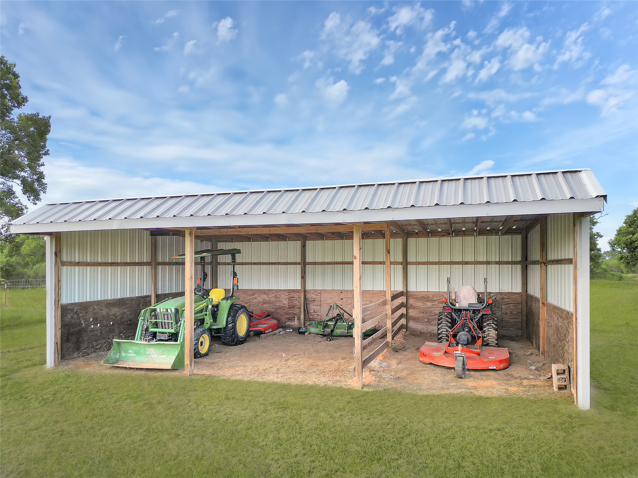 868 Lisa May Road Bellville, TX 77418 - Photo 29 of 39 Open shed provides covered parking for farm tractors and equipment
