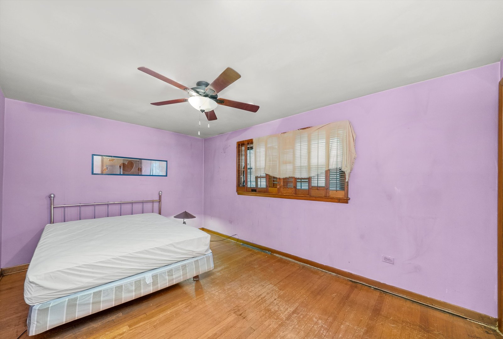 2044 West 69th Street Chicago, IL 60636 - Photo 14 of 27 a bedroom with a bed and a painting on the wall