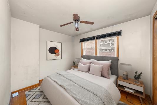 2044 West 69th Street Chicago, IL 60636 - Photo 15 of 27 a bedroom with a bed and a window