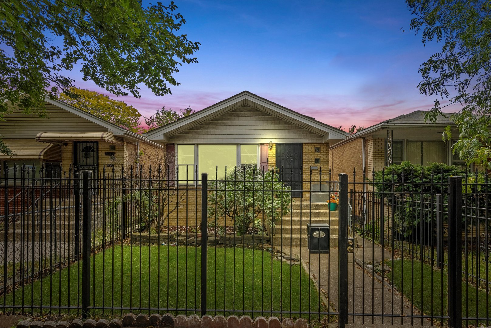 2044 West 69th Street Chicago, IL 60636 - Photo 27 of 27 a patio with table and chairs and potted plants