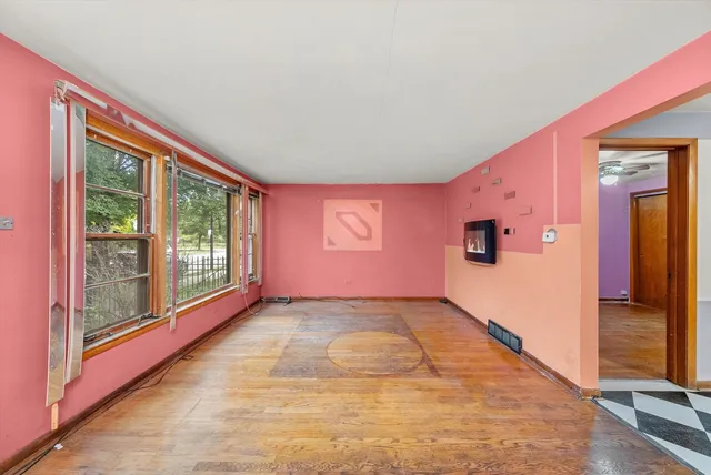 a view of an empty room with a window