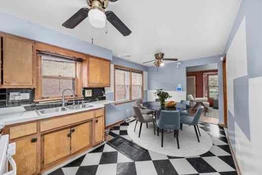 a view of a dining room with furniture and window