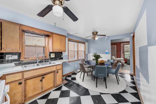 2044 West 69th Street Chicago, IL 60636 - Photo 6 of 27 a view of a dining room with furniture and window