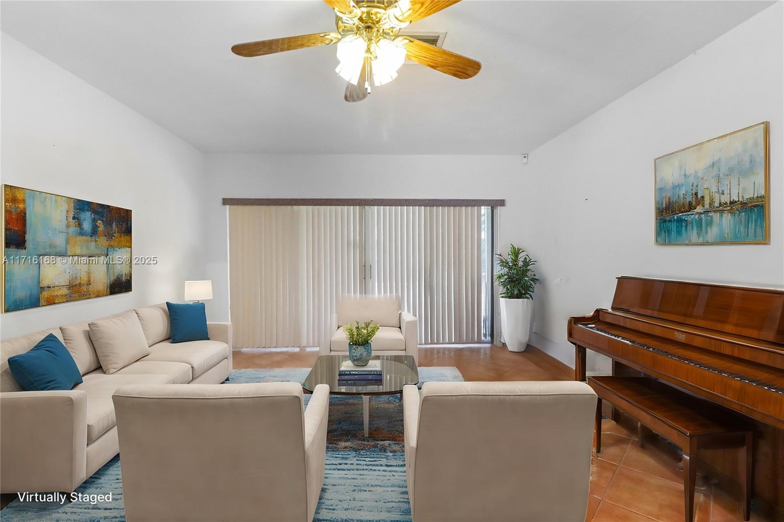 11023 Southwest 124th Road Miami, FL 33176 - Photo 3 of 34 a living room with furniture and a large window