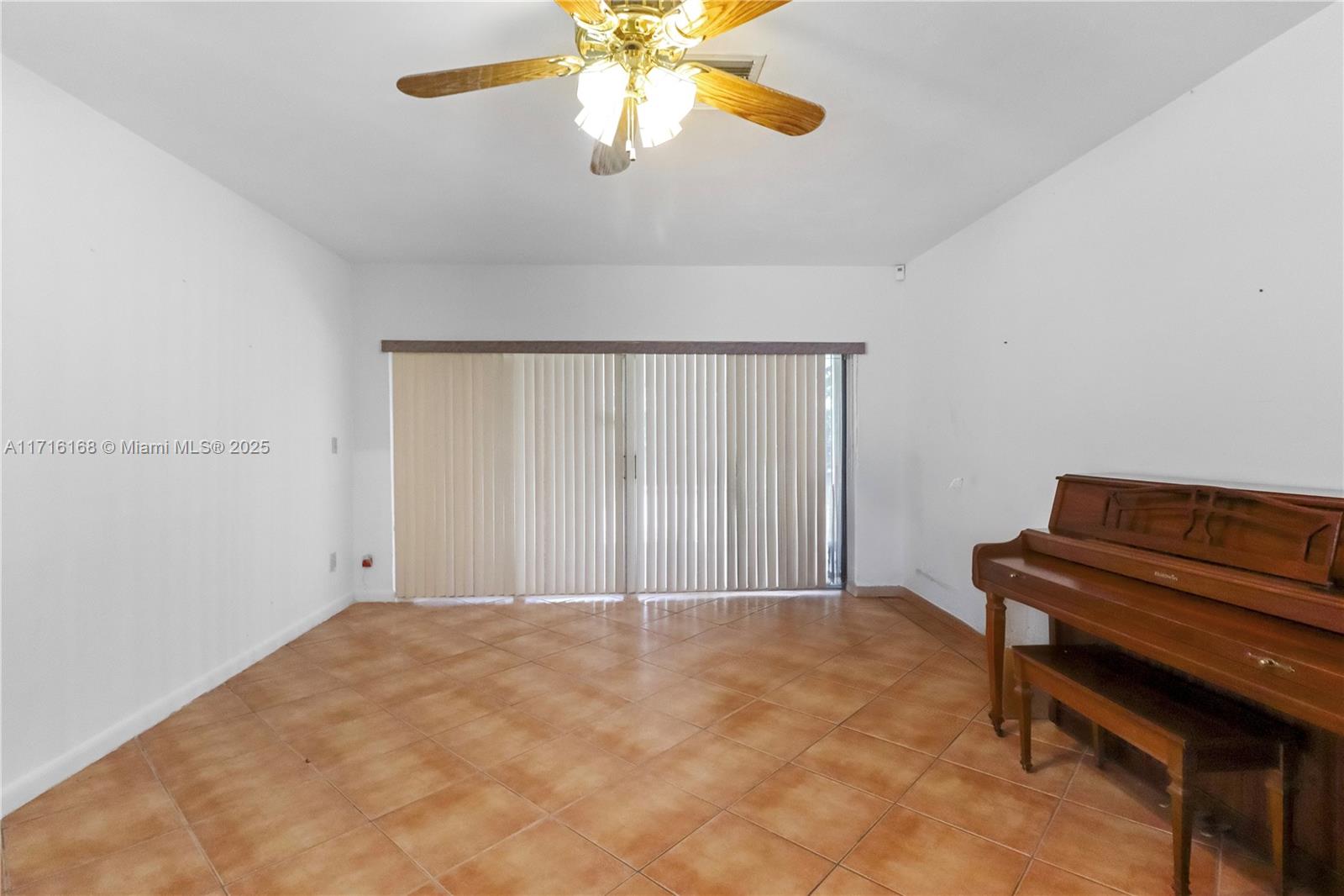 11023 Southwest 124th Road Miami, FL 33176 - Photo 4 of 34 a view of room with a ceiling fan
