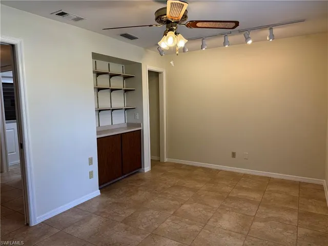 a view of swimming pool with outdoor seating and yard in back