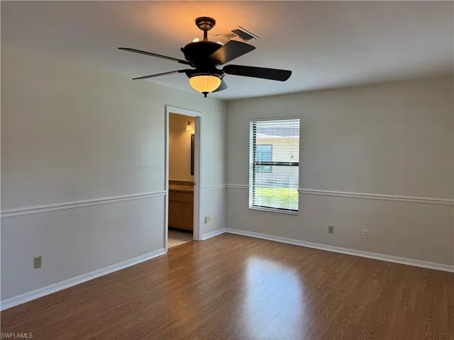 a view of a dinning table and chairs in the patio