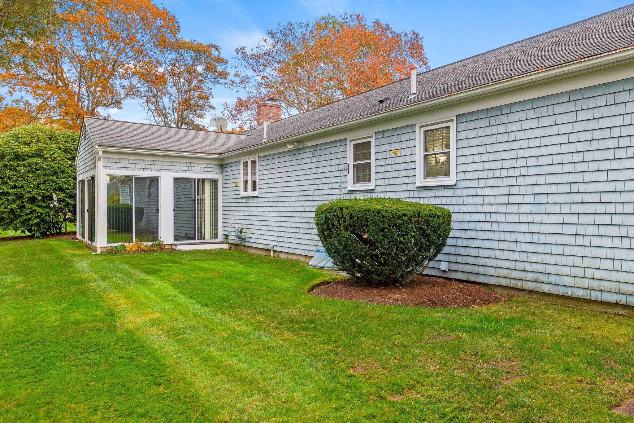 9 Ansel Howland Road Centerville, MA 02632 - Photo 21 of 27 a view of a backyard with plants and large tree