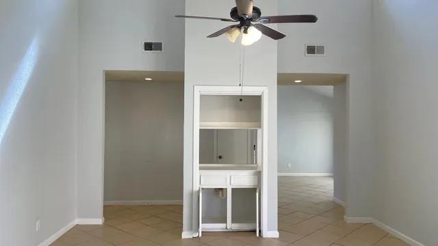 a view of an empty room with a bathroom