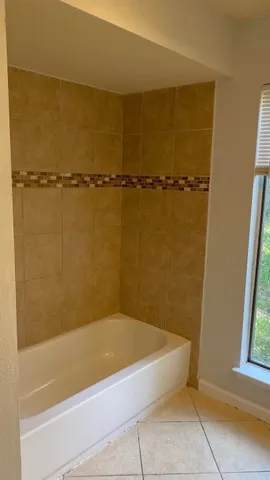 a bathroom with a bathtub