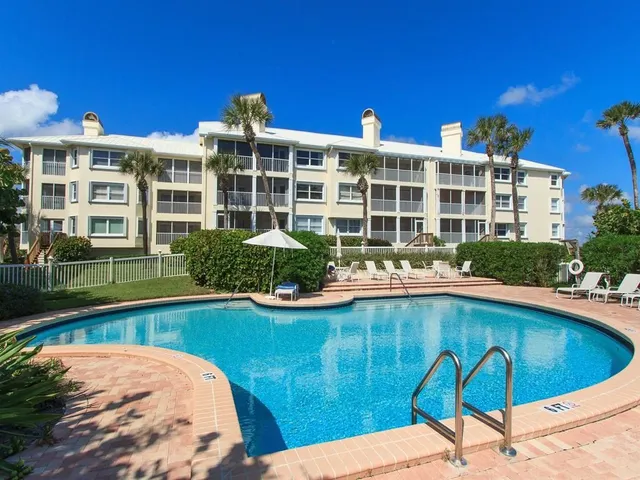 a view of a swimming pool with a lounge chairs