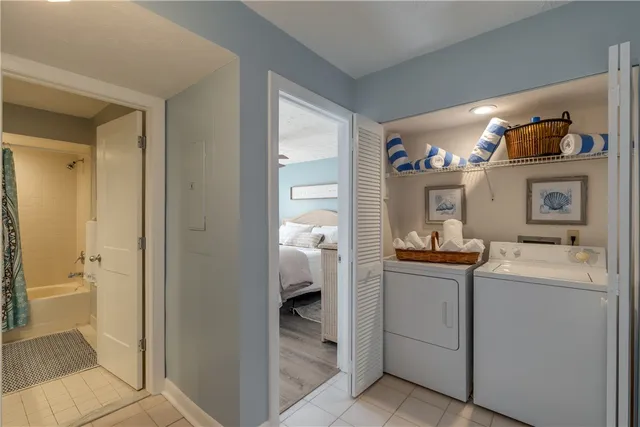 a room with a sink and a washer dryer