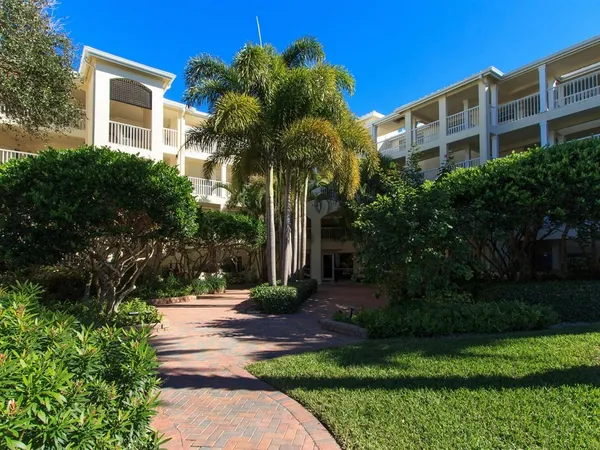 a view of a building with a yard