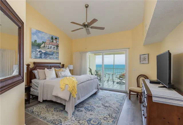 a bed room with a bed and a tv