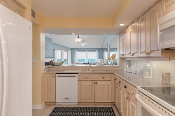 a kitchen with stainless steel appliances granite countertop a sink and cabinets