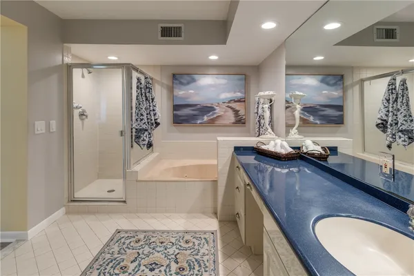 a view of a bathroom with dual sinks