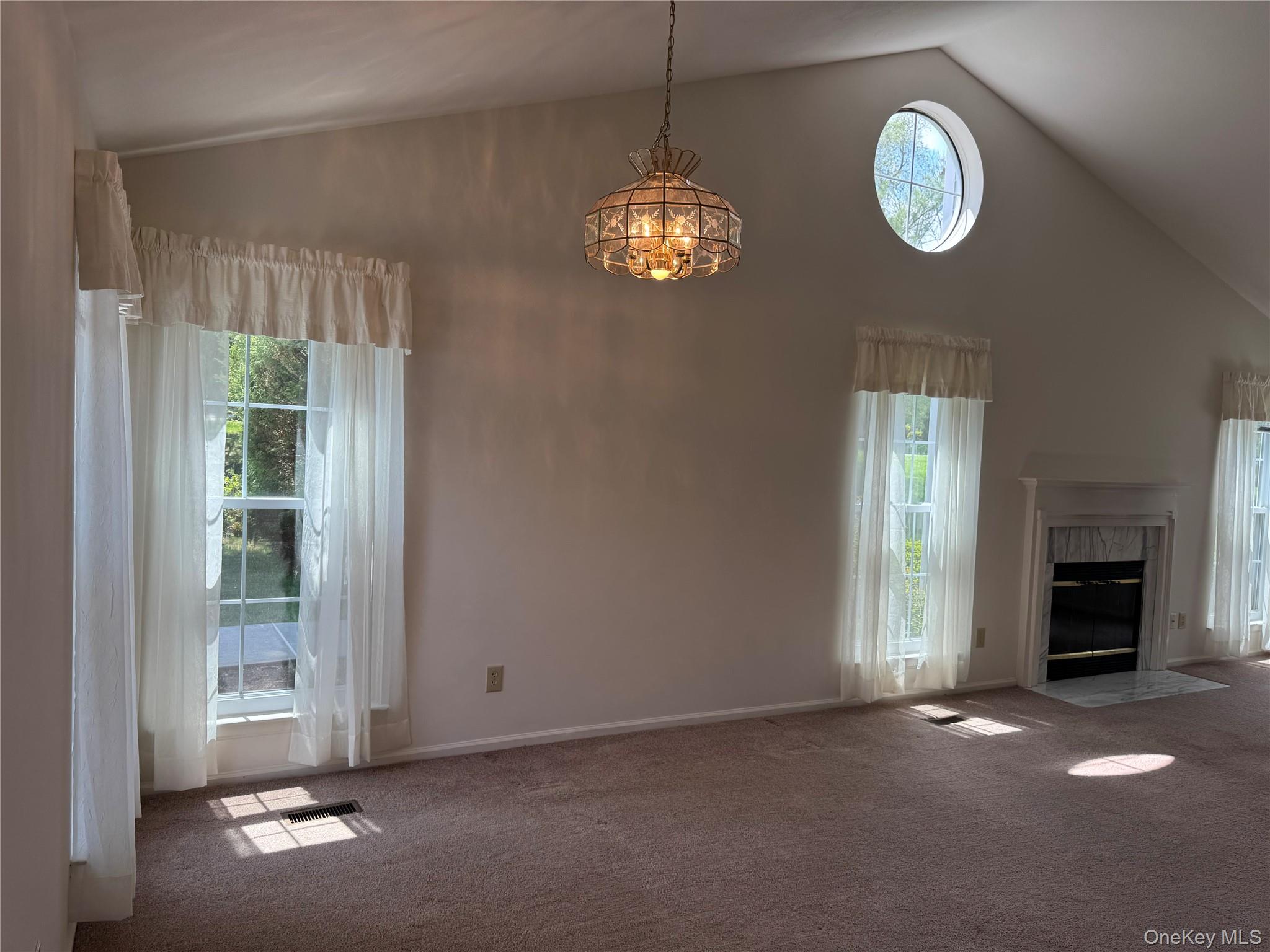 24 Olde Wagon Road Warwick, NY 10990 - Photo 8 of 47 Living room / Dining room with Cathedral ceiling and fireplace.
