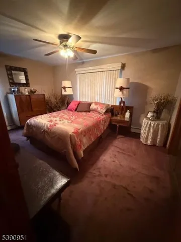 a bedroom with bed and window