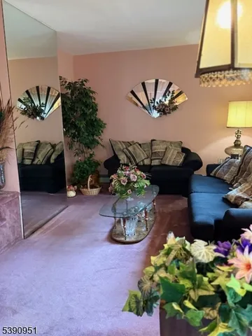 a table with a couch and a potted plant